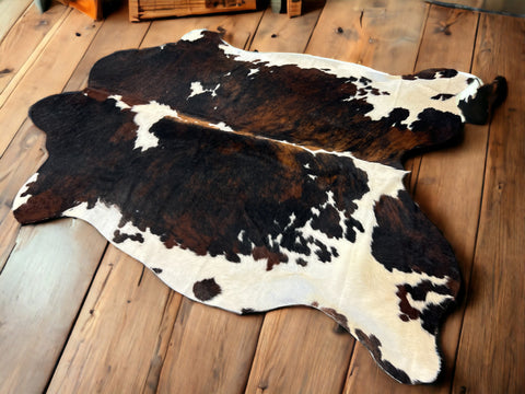 brown and black cowhide rug