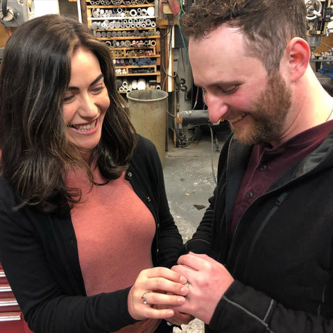 Woman proposing to man in Minter + Richter Designs Shop