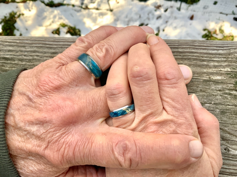 Blue Box Elder Wedding Rings on couple's hands