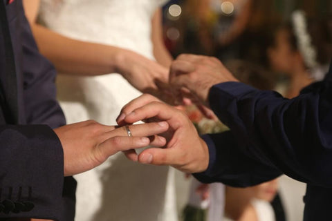 Orthodox Christian couple exchanging wedding rings