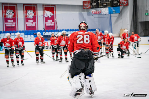 Sydney Bears' goaltender Anthony Kimlin skates to his team mates following another victory