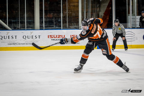 Melbourne Mustangs' defenceman Ty Wishart shoots the puck against the Sydney Bears