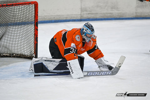 Melbourne Mustangs goaltender Liam Hughes makes a save