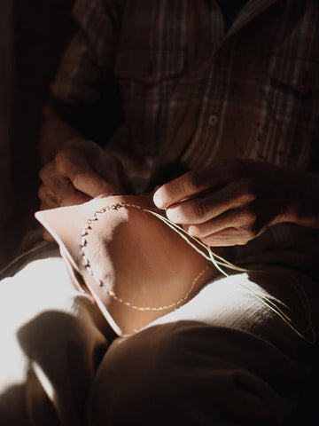 Babouche slippers being stitched by hand