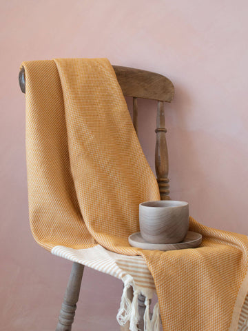 Hammam towel as a throw on a wooden chair
