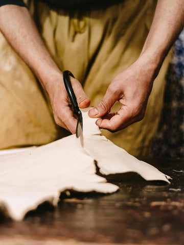 Soft leather being cut for babouche slippers