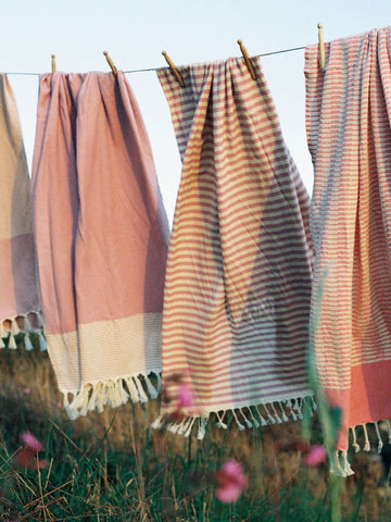 Pink hammam towels on a washing line