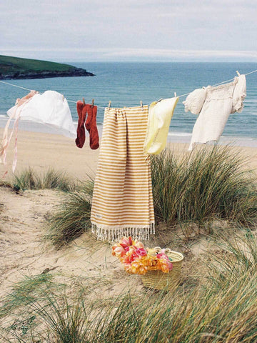 Classic stripe Sorrento cotton hammam towel on a washing line on the beach