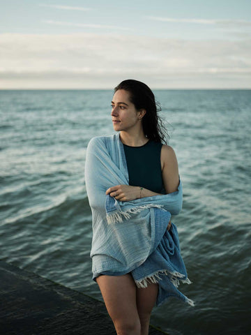 Wild swimmer wrapped in a Bohemia hammam towel