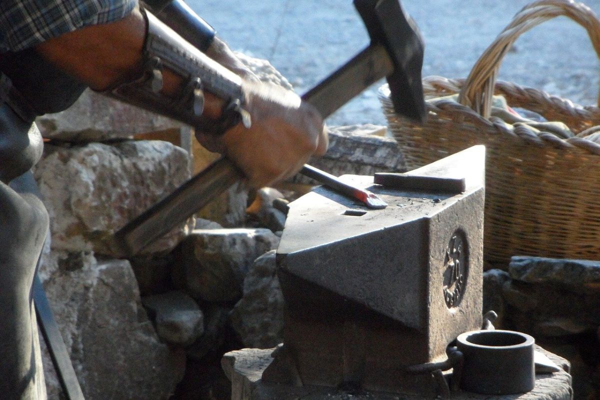 hand forging metal on the anvil