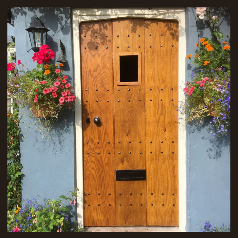 Period property front door with decorative nails