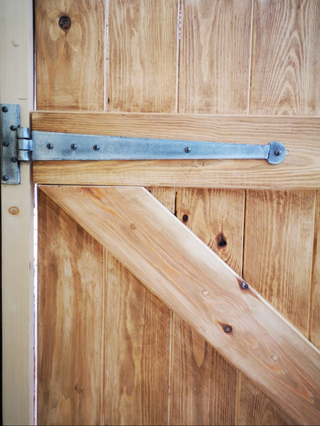 Ledge and brace door with pewter penny end T hinge
