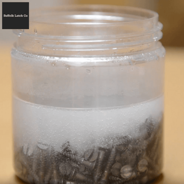 Screws soaking in citric acid solution