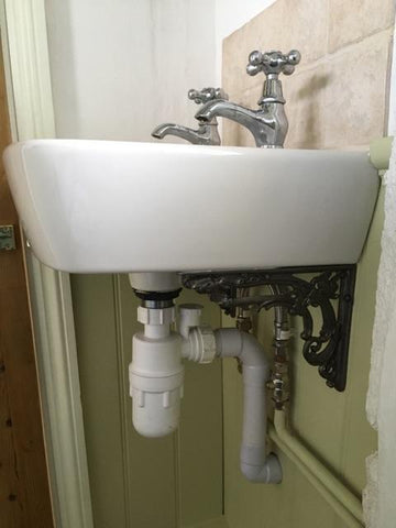 decorative brackets under sink