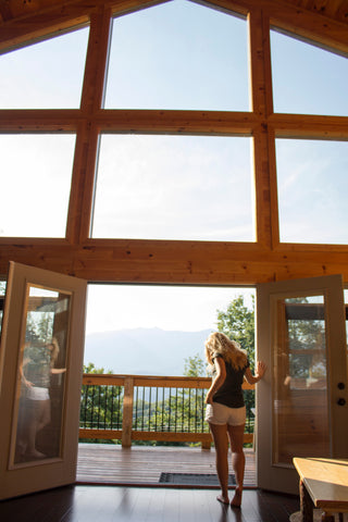 Windows with large glass panes and open patio doors