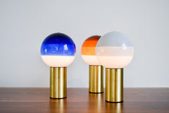 Three portable dipping lamps in white, blue and orange