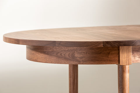 Curve of Highland Dining Table in walnut