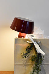 Red Bicoca lamp in Christmas gift bag