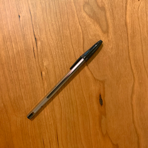 Pitch pocket on cherry table top with black pen for scale 