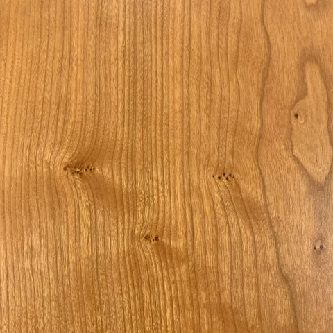 Cluster of pin knots in cherry wood