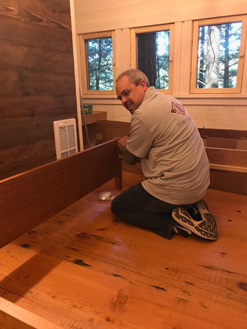 Chilton's Warehouse Manager Chris stone pauses his work setting up our Penobscot Sleigh Bed for a quick photo