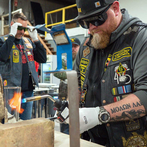 A veteran learns how to make a glass at BenShot's workshop in Appleton, Wisconsin