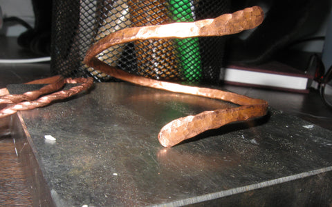 Copper bracelets on bench block