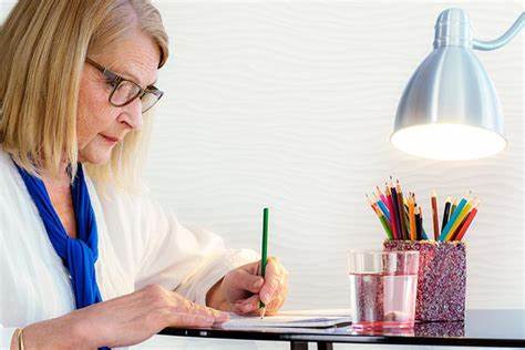 older woman coloring to reduce anxiety