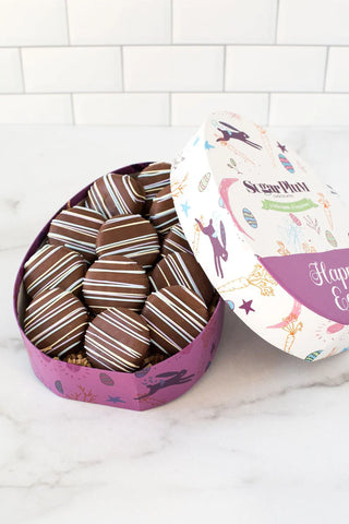 chocolate covered sandwich cookies with violet packaging