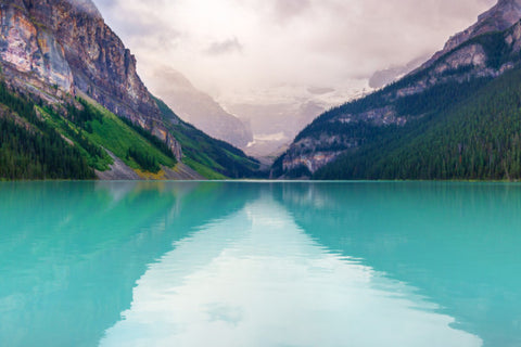 a turquoise lake runs between two mountains. view in Banff National Park in Canada.