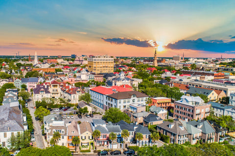 Aerial view of Charleston, South Carolina. sun setting over pastel houses.