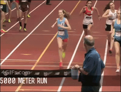 women's running race, woman runs in and wins last minute