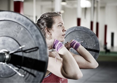 Woman lifting barbell weights