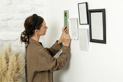 Woman Measures Space for a Tide Clock