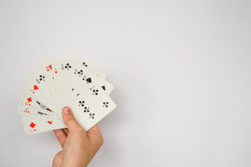 Hand showing deck of cards