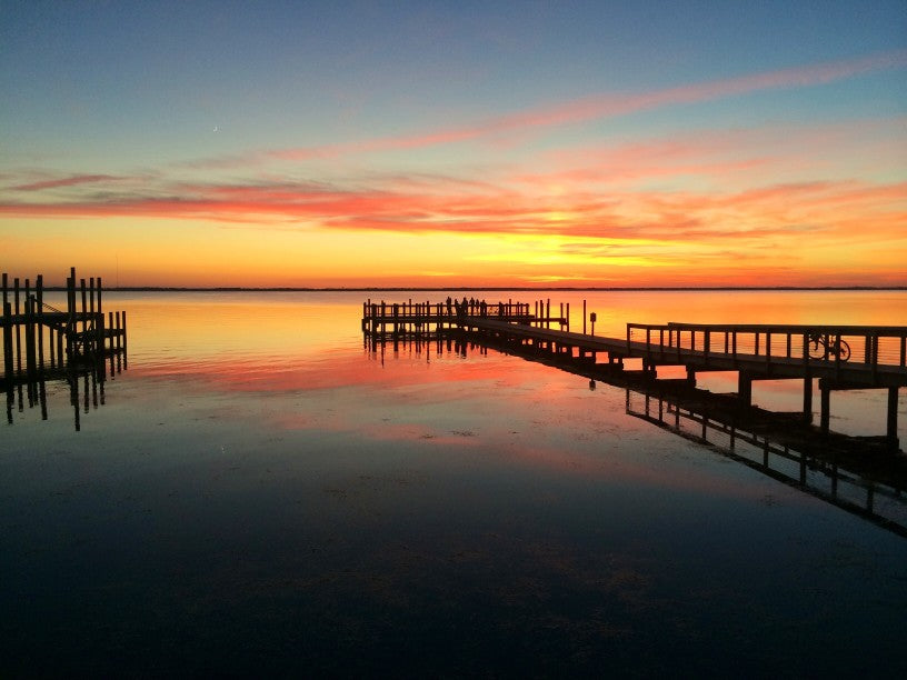 Beautiful orange and blue sunset on the coast of Outer Banks