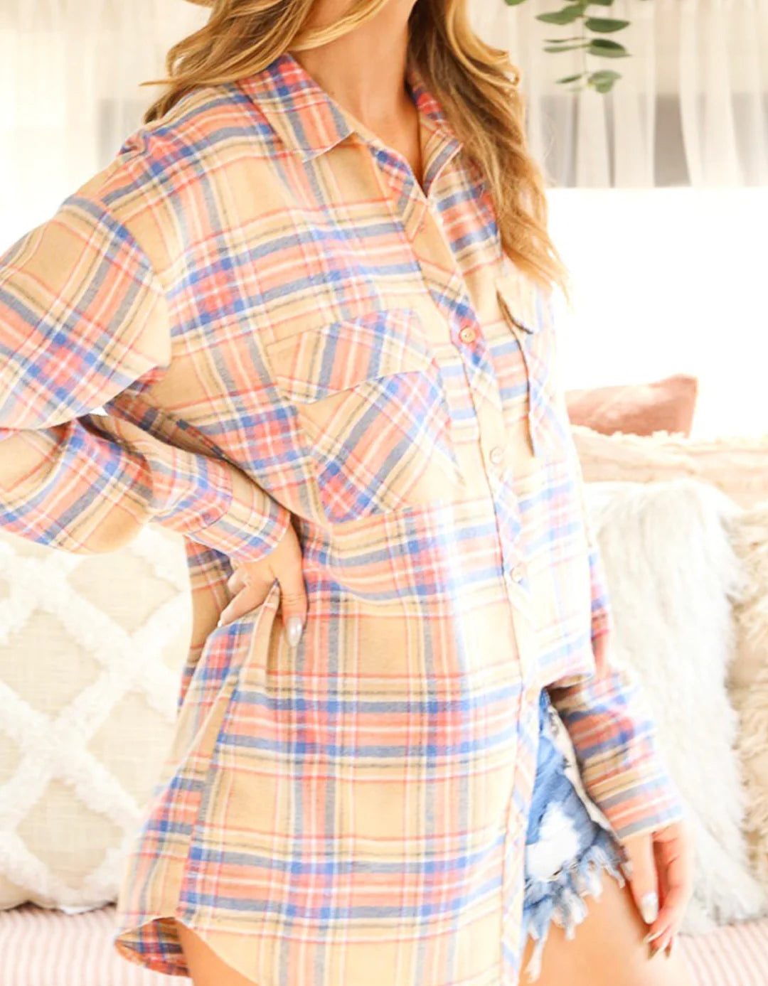 a woman in a plaid shacket