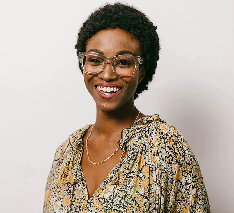 a woman wearing square framed, clear blue light glasses