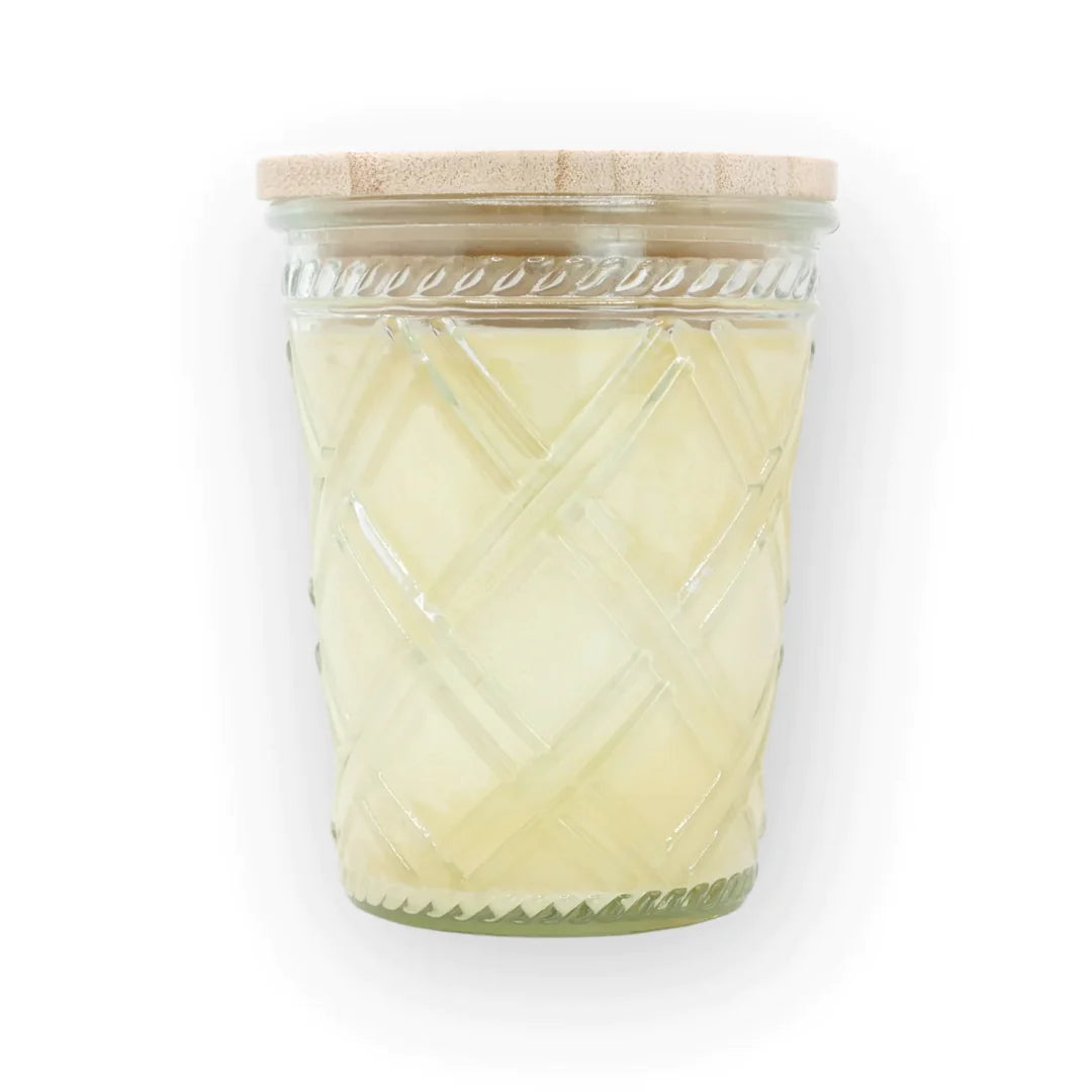 a Swan Creek yellow candle in a glass jar