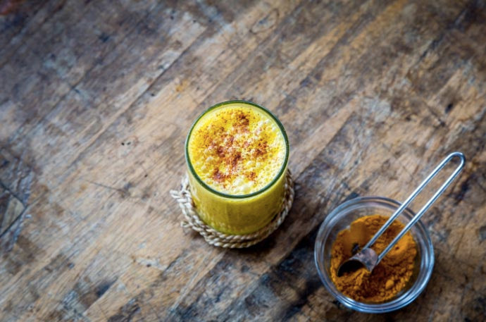 A picture of a turmeric drink on a table.