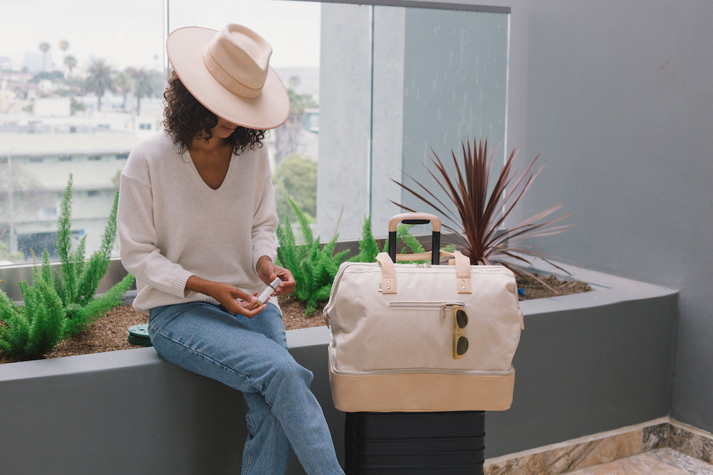 Woman traveling with Sagely Naturals CBD products