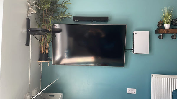 ps5 wall next to tv