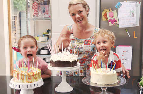 modern mommy doing diy cake decorating with her kids