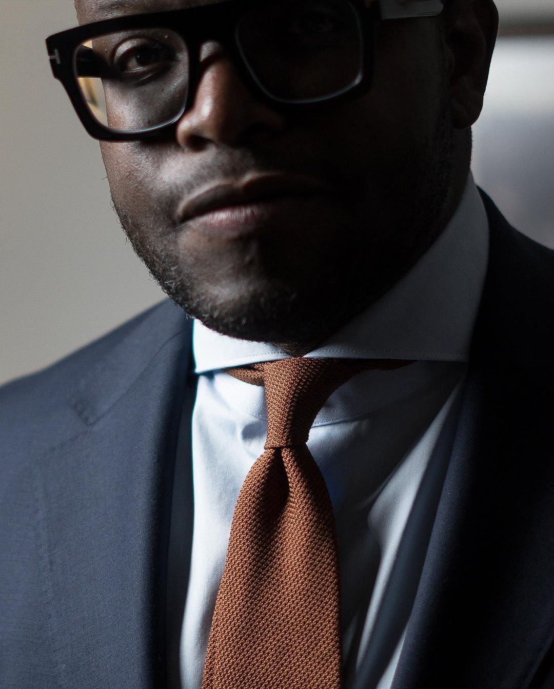 Aklasu Burnt Orange Tie Paired with Blue Suit