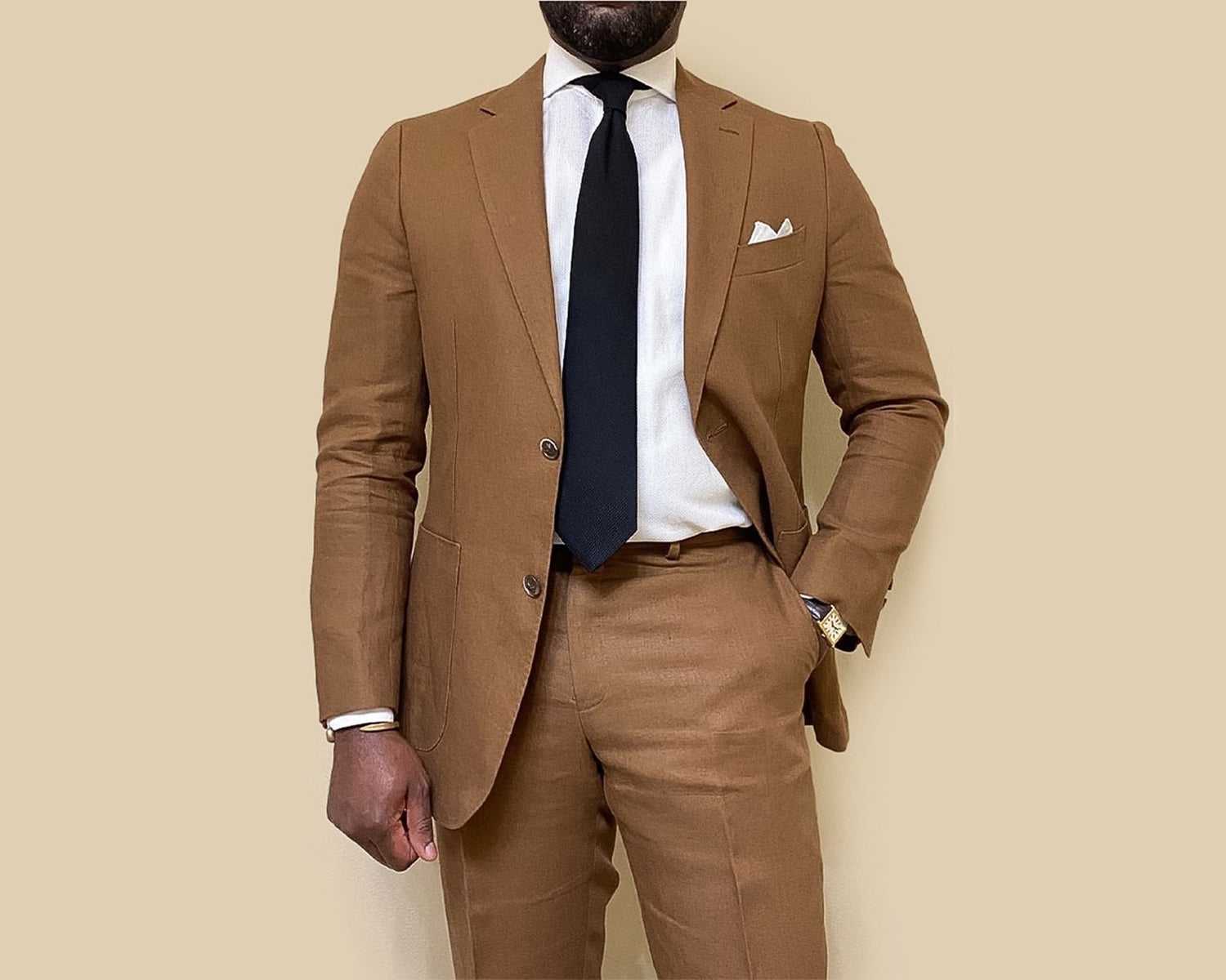 6 Business Casual Outfits for Men that Don't Play it Safe Black Aklasu Grenadine Tie with Light Brown Suit