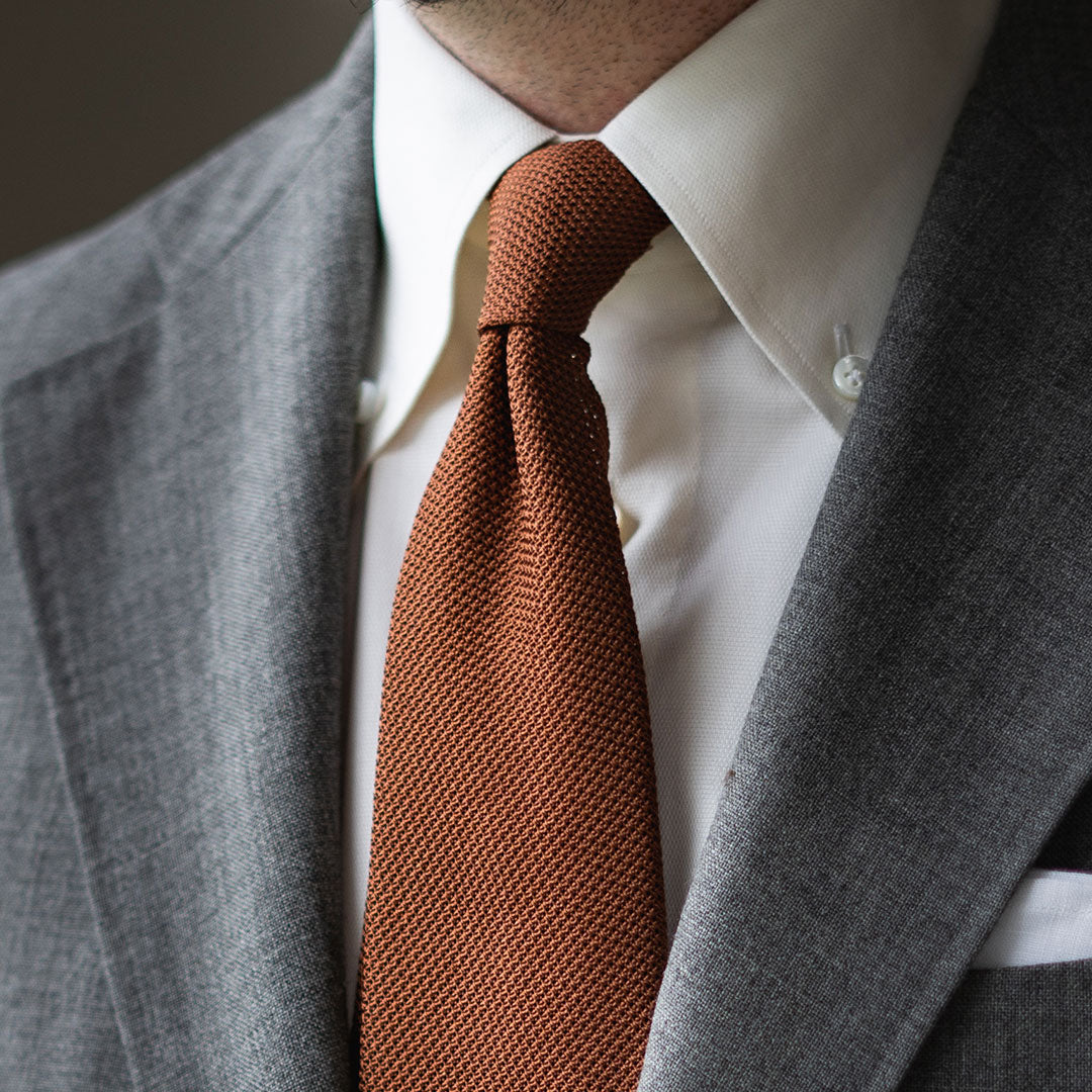 Grey Suit With A Burnt Orange Tie