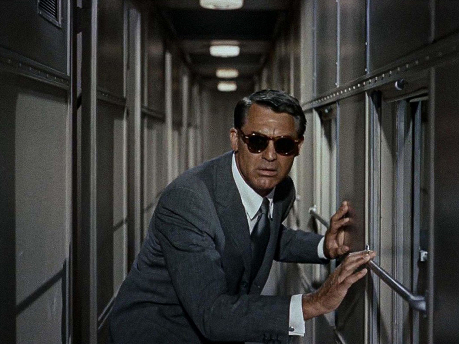 Cary Grant in a Grey Suit and Grey Tie in the movie North By Northwest