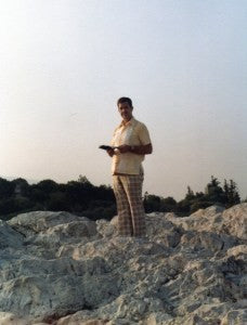 Charlie Jones reading his Bible in the Holy Land.