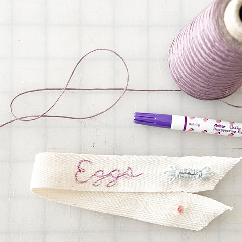 writing Eggs on the sash with a marking pen