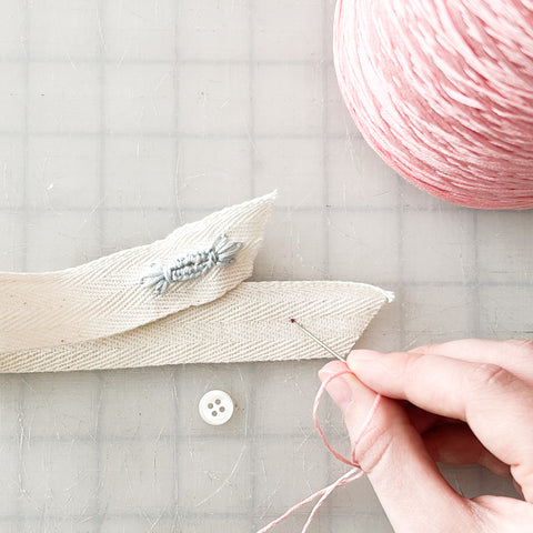 marking where your button should be sewn